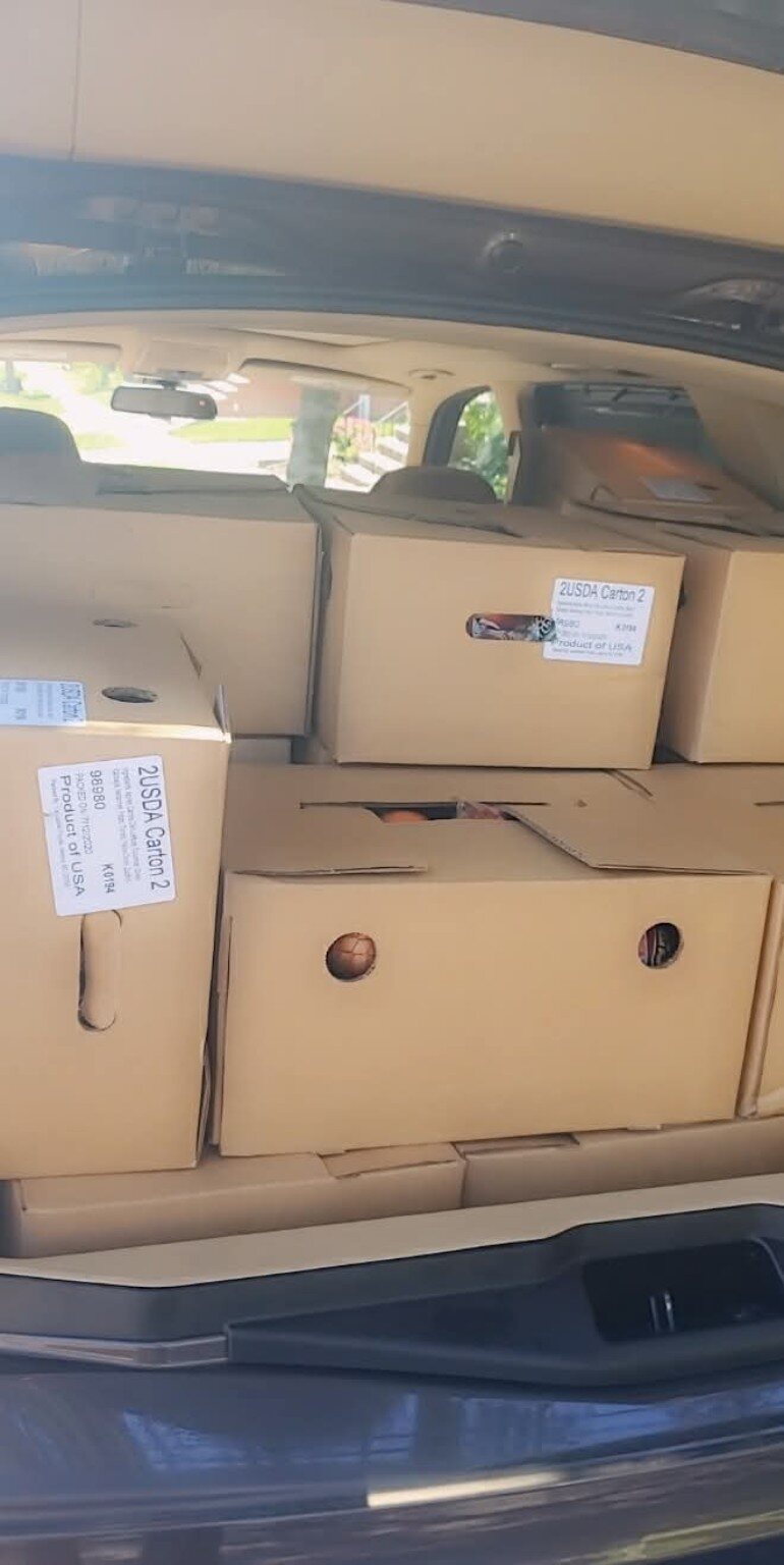 A vehicle loaded with food boxes for delivery